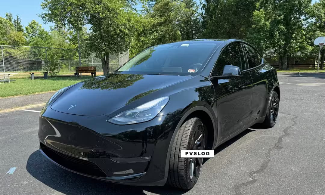 2023 Tesla Model Y Long Range AWD in Solid Black, Front Right