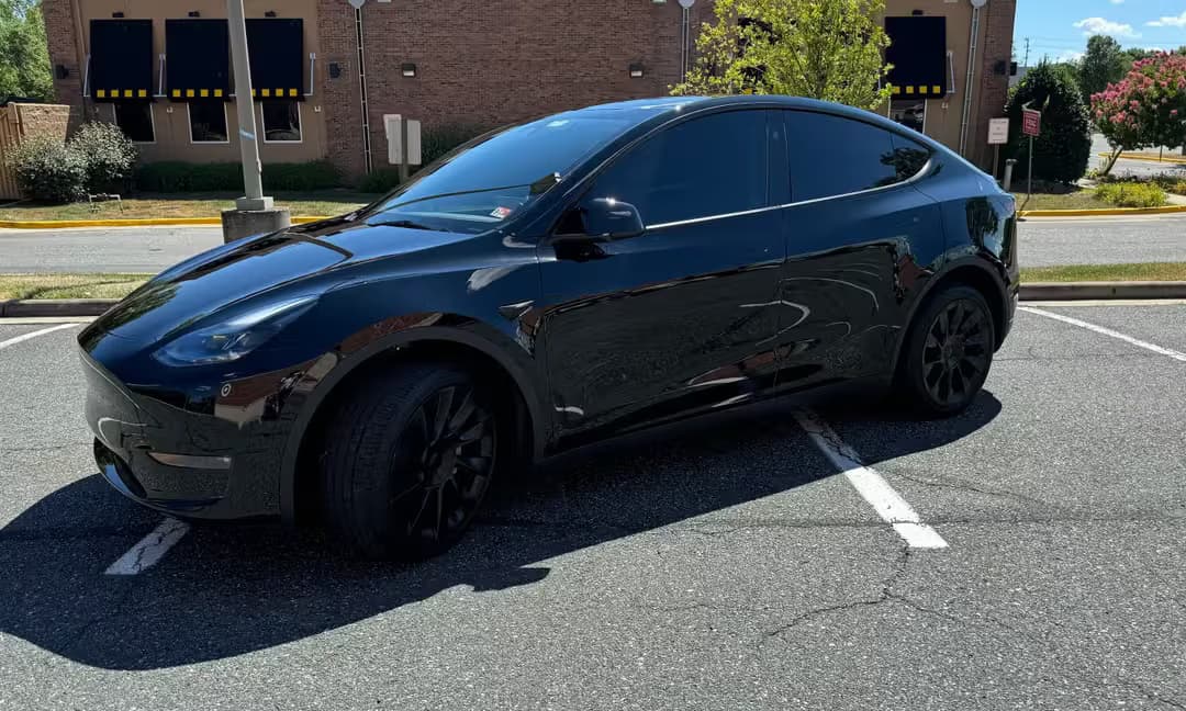 2023 Tesla Model Y Long Range AWD in Solid Black, Side Rear
