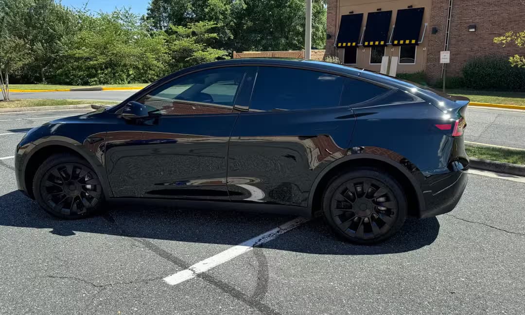 2023 Tesla Model Y Long Range AWD in Solid Black, Side Profile