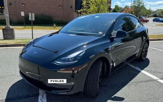 2023 Tesla Model Y Long Range AWD in Solid Black, Front Left