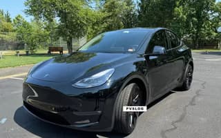 2023 Tesla Model Y Long Range AWD in Solid Black, Front Right