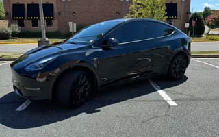 2023 Tesla Model Y Long Range AWD in Solid Black, Side Rear