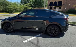 2023 Tesla Model Y Long Range AWD in Solid Black, Side Profile