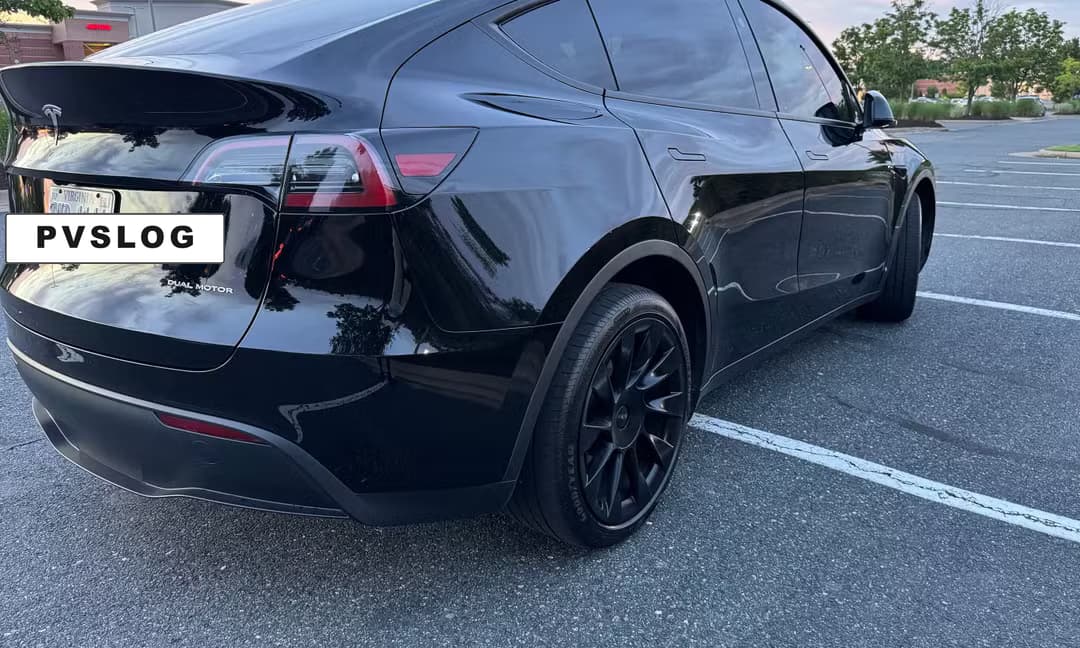 2023 Tesla Model Y Long Range AWD in Solid Black, Rear Angle