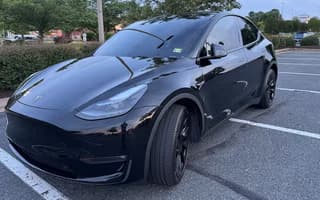 2023 Tesla Model Y Long Range AWD in Solid Black, Front Right