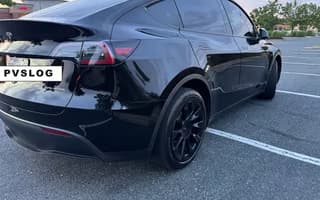 2023 Tesla Model Y Long Range AWD in Solid Black, Rear Angle