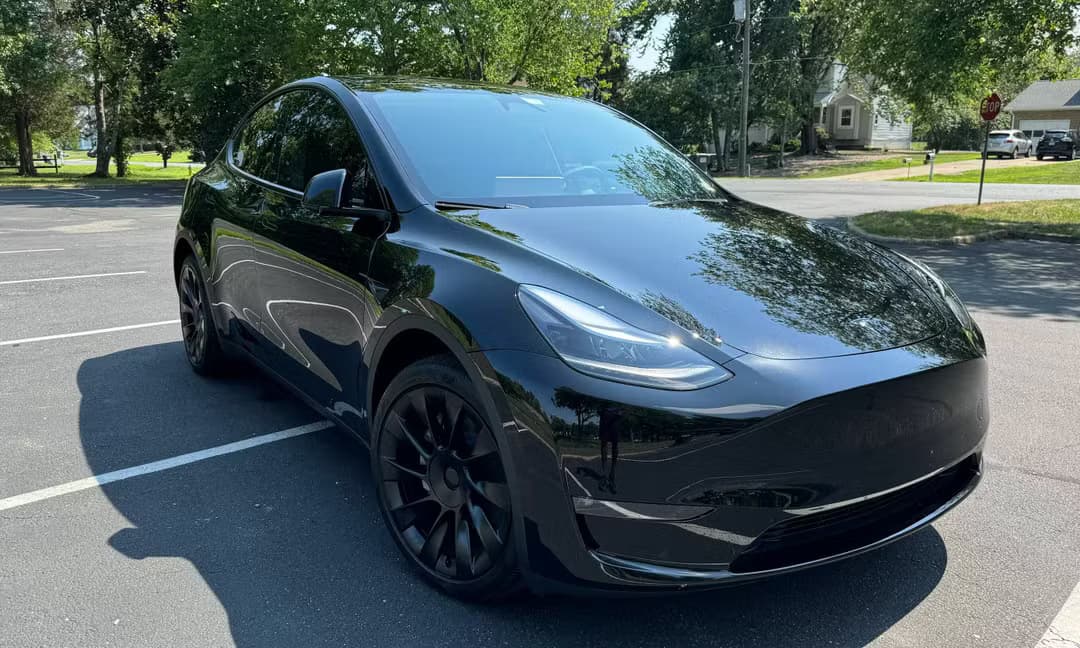 2023 Tesla Model Y Long Range AWD in Solid Black, Front Right