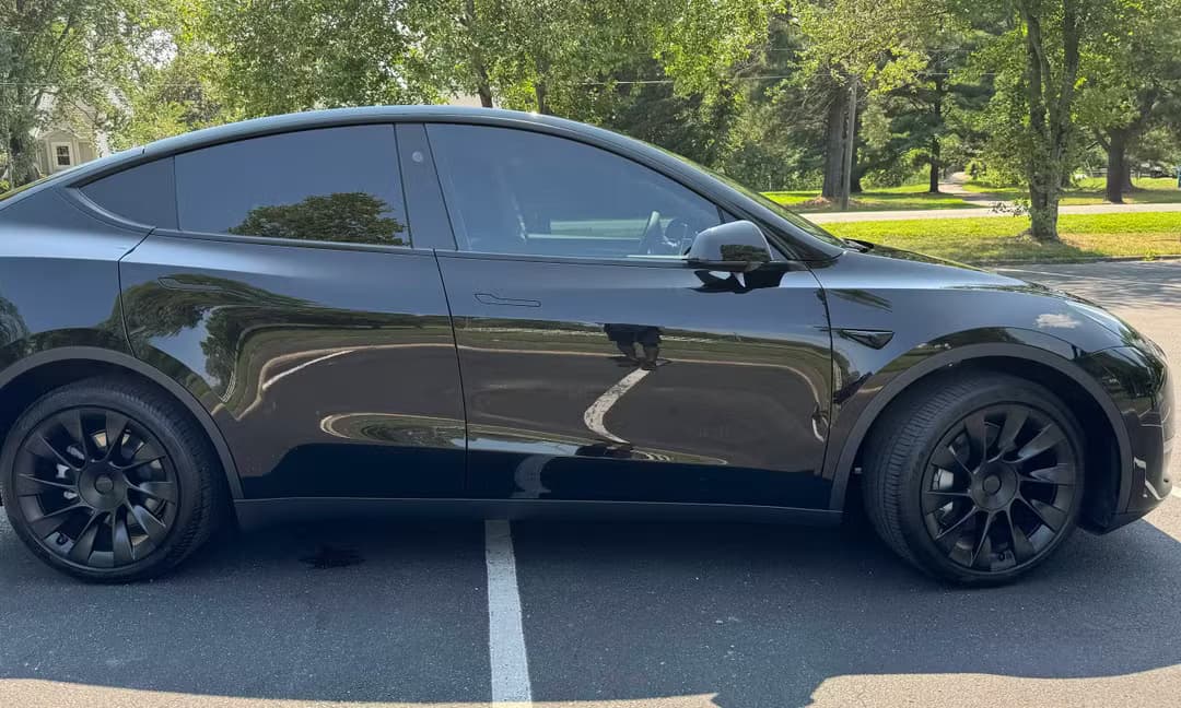 2023 Tesla Model Y Long Range AWD in Solid Black, Side Profile