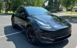 2023 Tesla Model Y Long Range AWD in Solid Black, Front Right