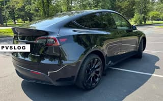 2023 Tesla Model Y Long Range AWD in Solid Black, Rear Angle