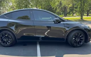 2023 Tesla Model Y Long Range AWD in Solid Black, Side Profile