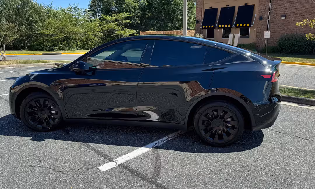 2023 Tesla Model Y Long Range AWD in Solid Black, Side Profile