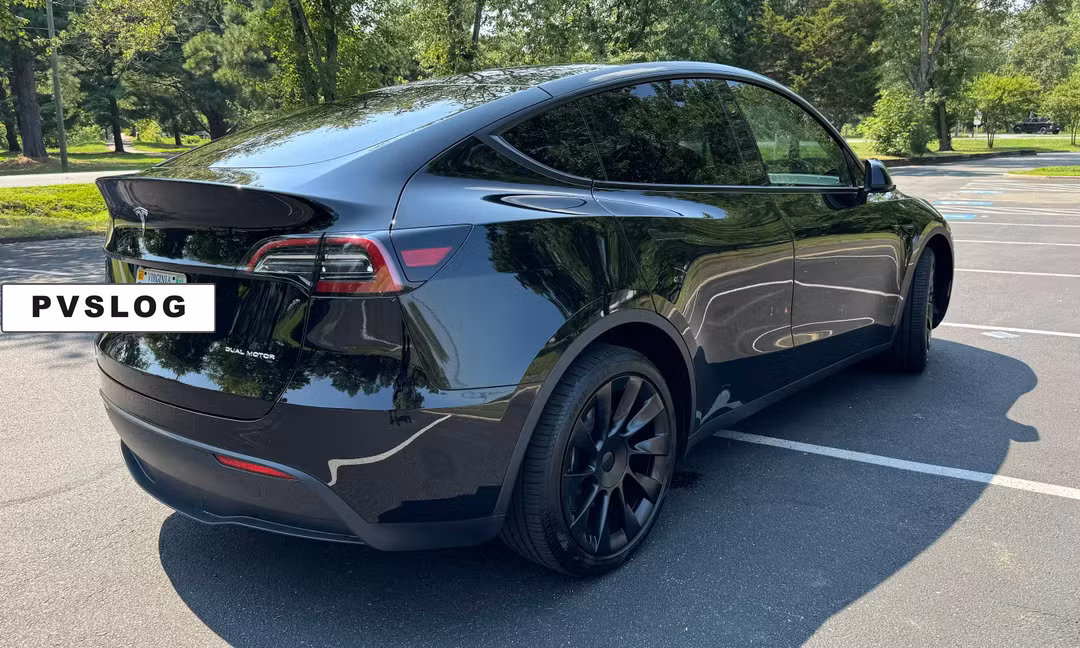 2023 Tesla Model Y Long Range AWD in Solid Black, Rear Angle